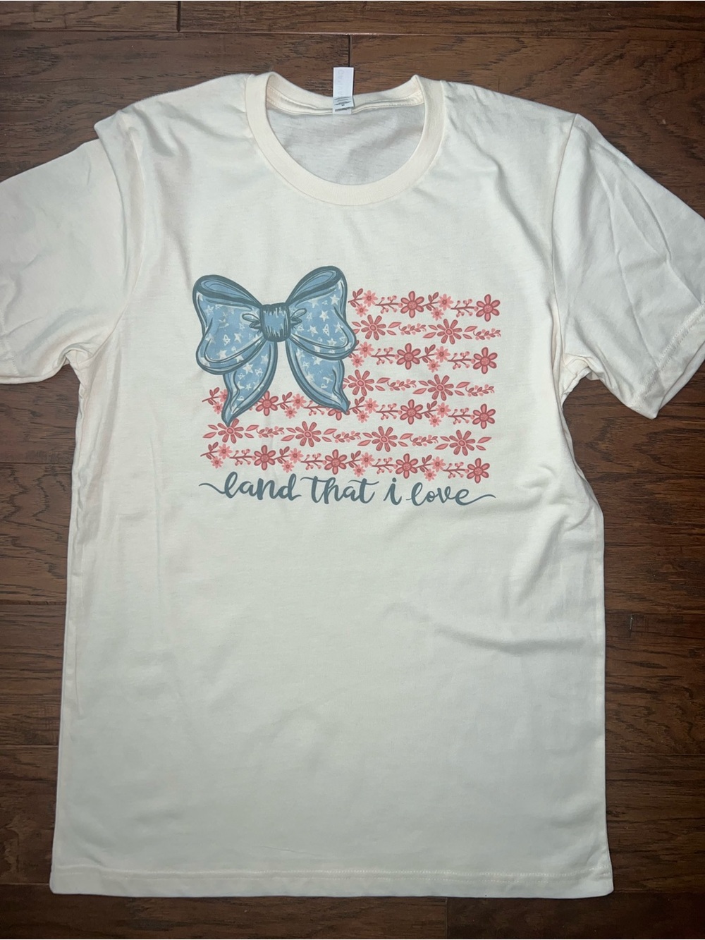 NEW "Land That I Love" Cream Graphic Tee with Blue Bow